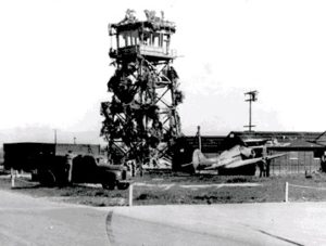This photo shows camoflauge on the Airport Tower during WWII. Note the skid marks and the aircraft to the right. Someone took a wrong turn!