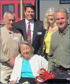 Photo of Doug Pryor, Jon Stout, Jennifer Sloan, Riis Burwell, and in front, Judy Voigt at the 2012 dedication ceremony.