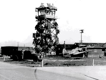 Photo of STS in 1942, showing U.S. Army soldiers and airplanes flying overhead.